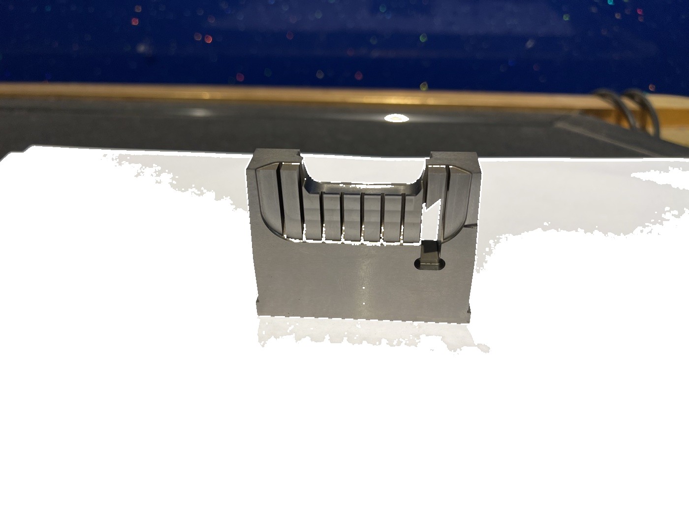 Precision mold insert showing multiple machined features and assembly interfaces